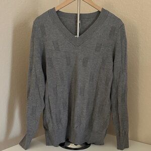 Women’s gray V-neck sweater